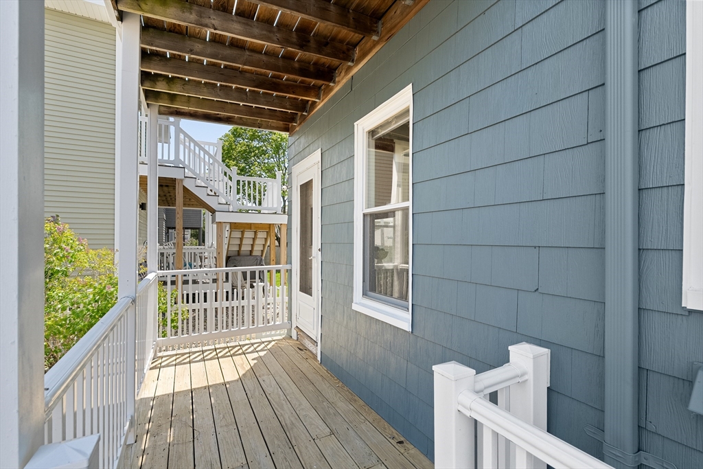 2 Thorndike Street, Unit 2 Arlington, MA 02474 - Photo 21 of 22 a view of a porch with wooden floor