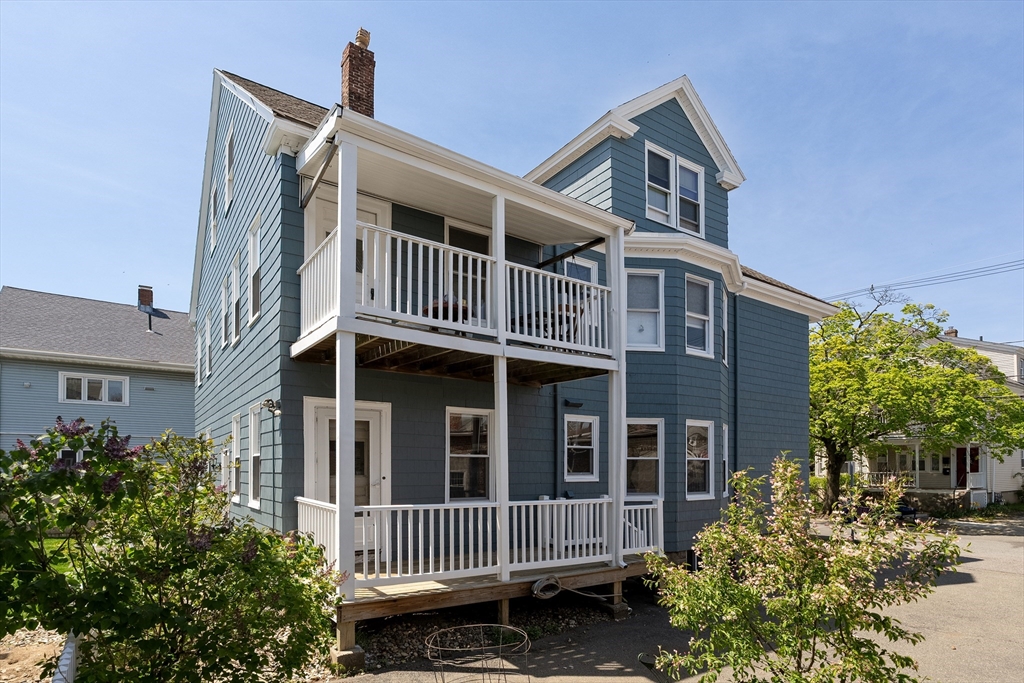 2 Thorndike Street, Unit 2 Arlington, MA 02474 - Photo 22 of 22 a front view of a house with a yard