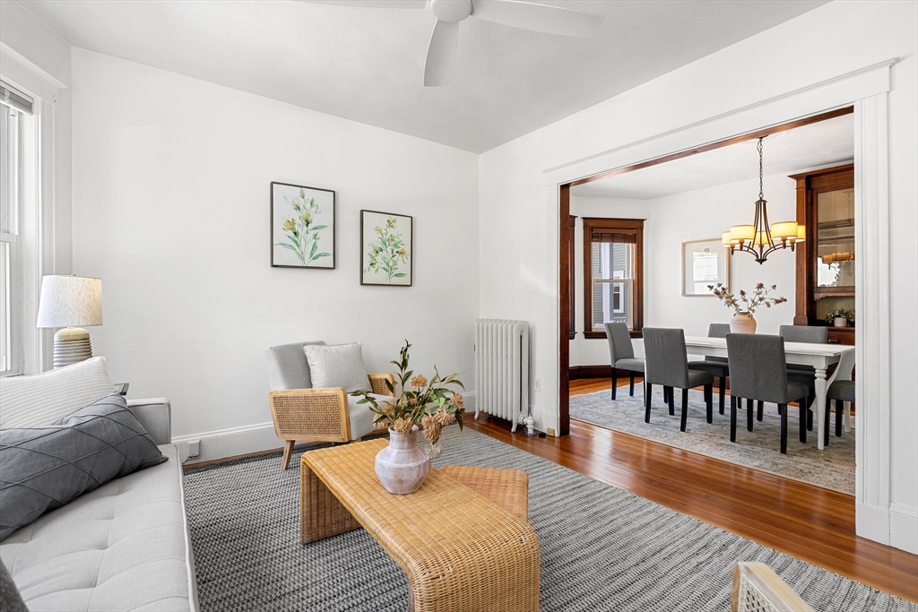 2 Thorndike Street, Unit 2 Arlington, MA 02474 - Photo 6 of 22 a living room with furniture and a wooden floor