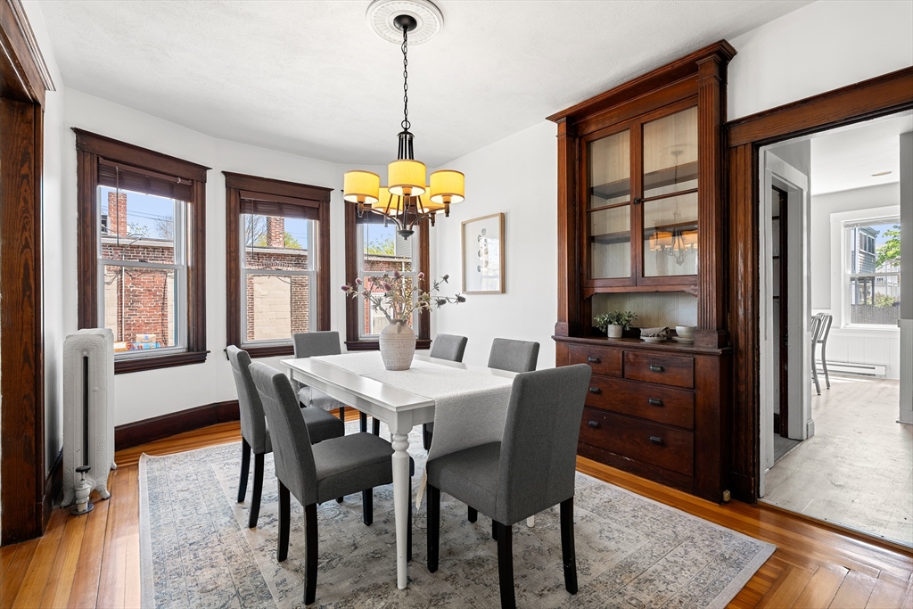 2 Thorndike Street, Unit 2 Arlington, MA 02474 - Photo 7 of 22 a view of a dining room with furniture window and wooden floor