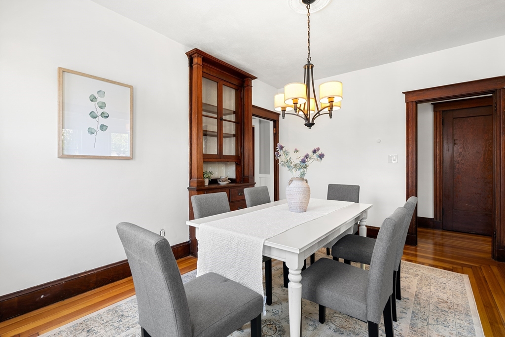 2 Thorndike Street, Unit 2 Arlington, MA 02474 - Photo 9 of 22 a view of a dining room with furniture window and wooden floor