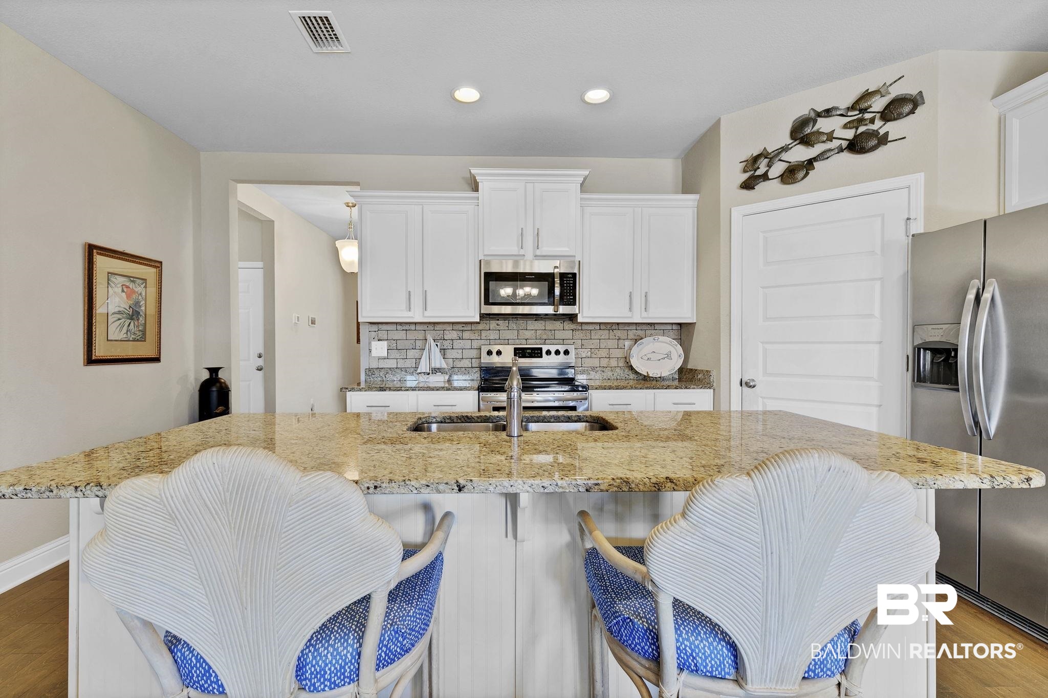1547 Kairos Loop Foley, AL 36535 - Photo 14 of 55 Kitchen featuring visible vents, decorative backsplash, appliances with stainless steel finishes, white cabinetry, and a sink