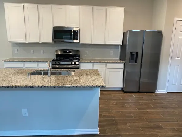 a bathroom with a sink and mirror