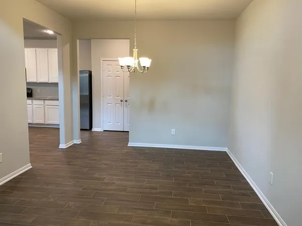 a view of an entryway with wooden floor