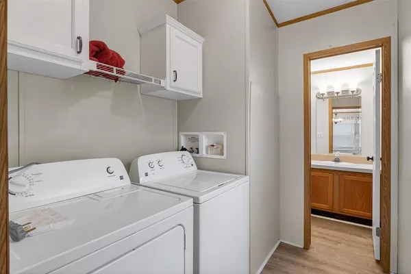 a spacious bedroom with a bed and ceiling fan