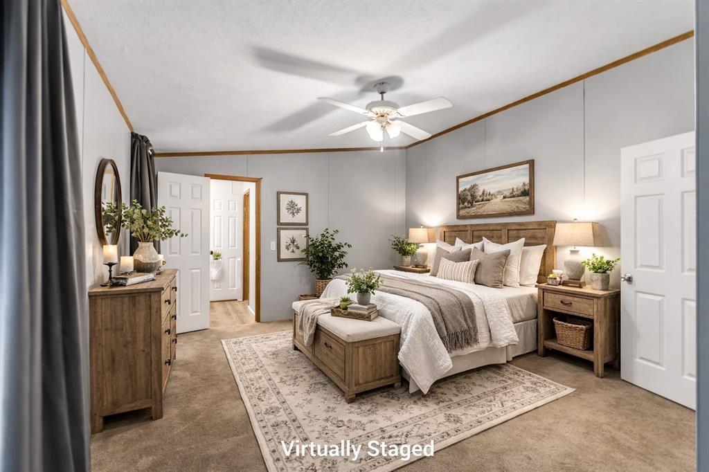 1202 Princeton Road Princeton, LA 71067 - Photo 16 of 32 a spacious bedroom with a bed and ceiling fan