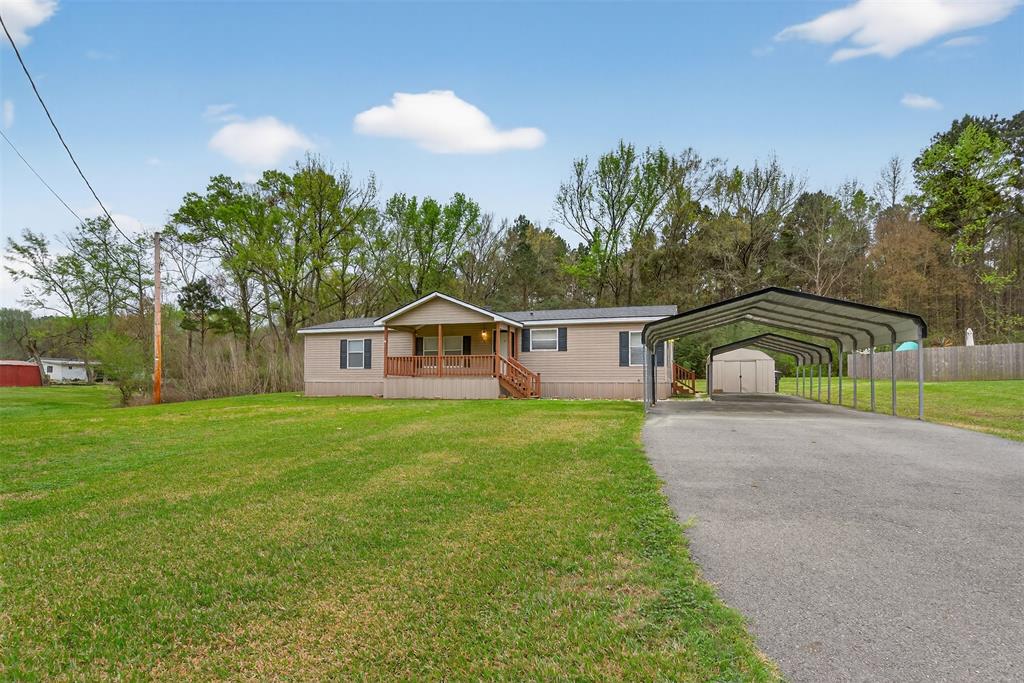 1202 Princeton Road Princeton, LA 71067 - Photo 3 of 32 a front view of a house with garden