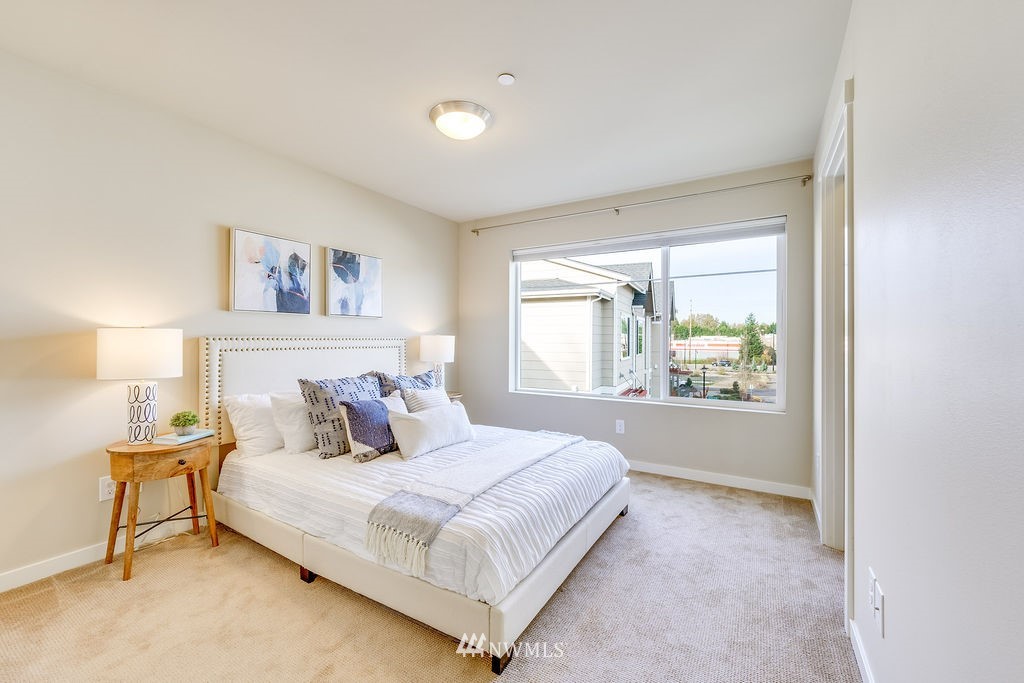 4227 Northeast 3rd Lane Renton, WA 98059 - Photo 14 of 40 a bedroom with a bed and a window