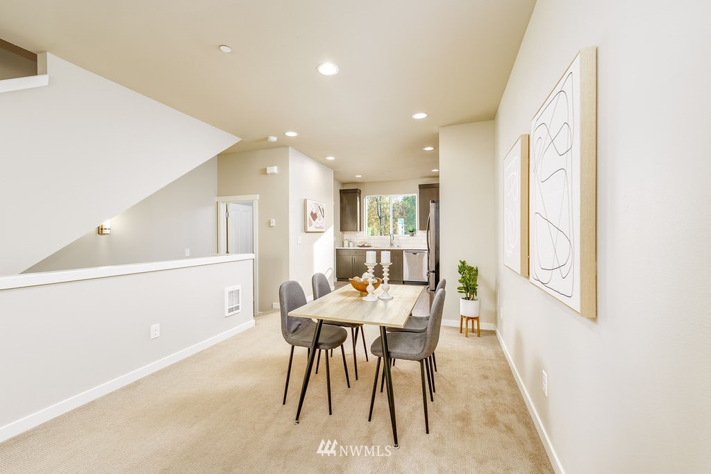 4227 Northeast 3rd Lane Renton, WA 98059 - Photo 8 of 40 a view of a dining room with furniture and a window