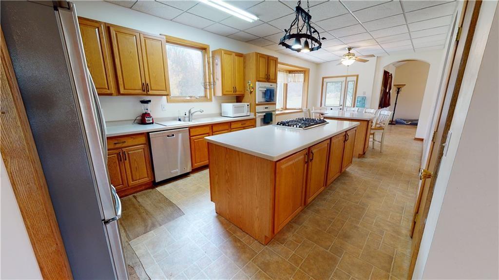 3902 Knoyle Road Erie, PA 16510 - Photo 5 of 25 a kitchen with stainless steel appliances granite countertop a sink a stove and a refrigerator
