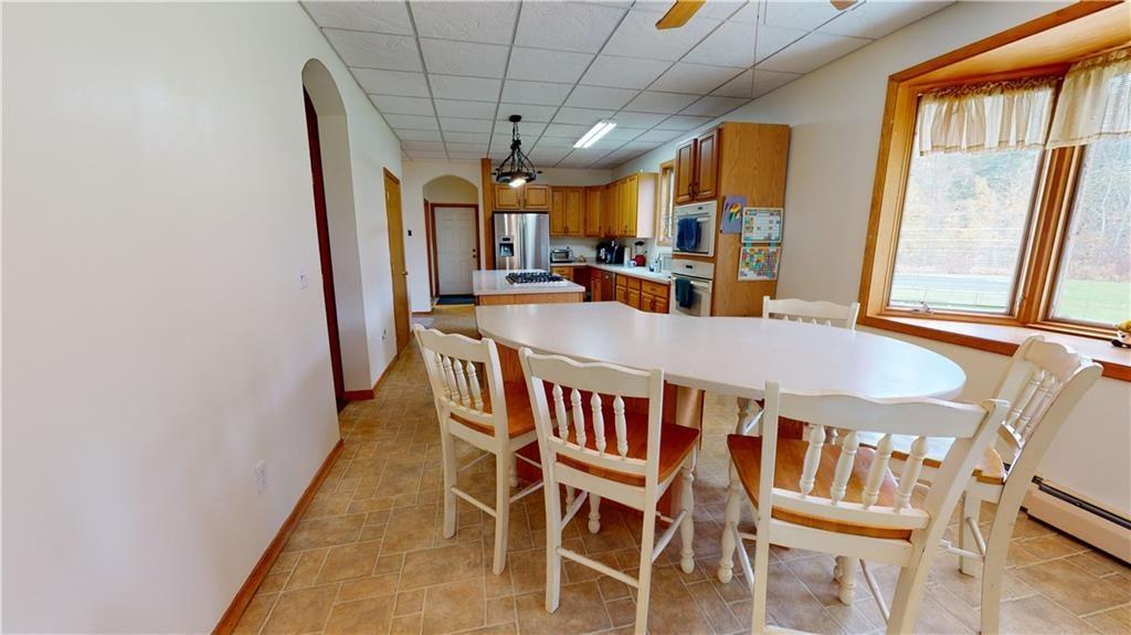 3902 Knoyle Road Erie, PA 16510 - Photo 6 of 25 a view of a dining room with furniture window and wooden floor