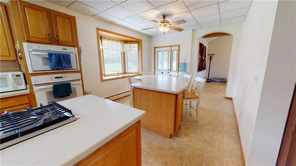 3902 Knoyle Road Erie, PA 16510 - Photo 7 of 25 a living room with stainless steel appliances furniture a rug and a window