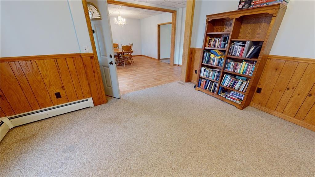 3902 Knoyle Road Erie, PA 16510 - Photo 8 of 25 a view of an empty room with bookshelf