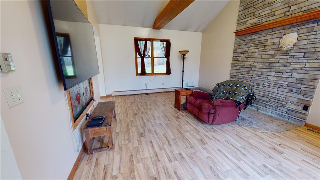 3902 Knoyle Road Erie, PA 16510 - Photo 9 of 25 a living room with furniture and a flat screen tv