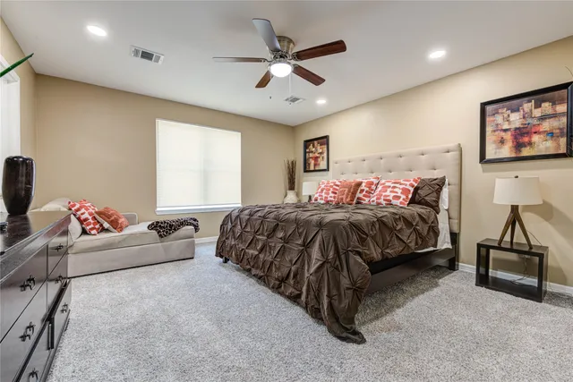 a bedroom with a bed and couch