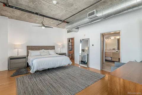 a bedroom with a bed and a walk in closet