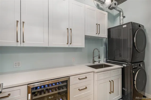 a kitchen with stainless steel appliances a cabinets and a stove top oven