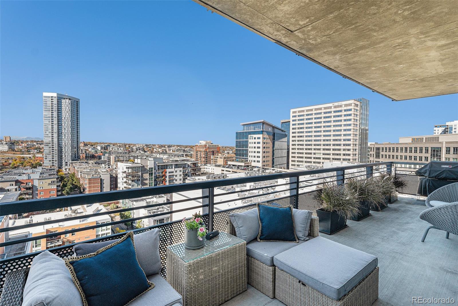 1401 Wewatta Street, Unit 1202 Denver, CO 80202 - Photo 31 of 50 a view of roof deck with seating space and stairs