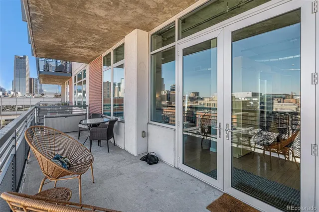 a view of a dining room with furniture and front door