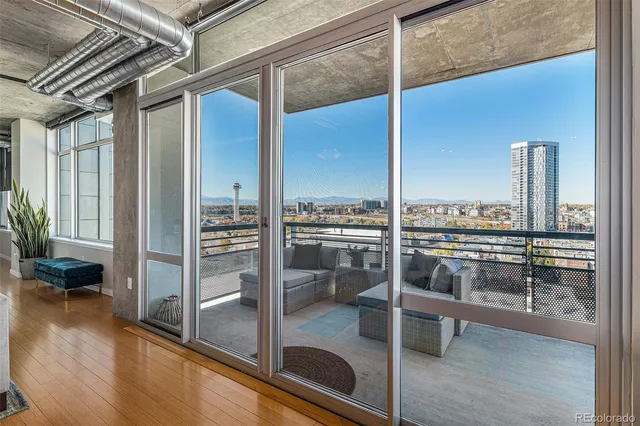 a view of a living room and a balcony