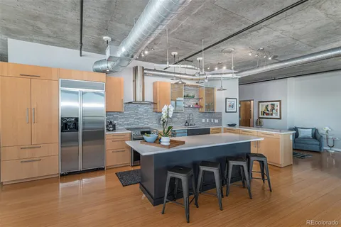 a dining table with chairs and wooden floor