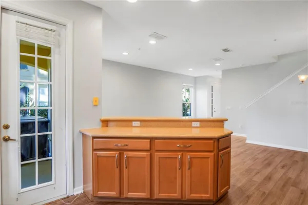 a kitchen with a sink cabinets and window