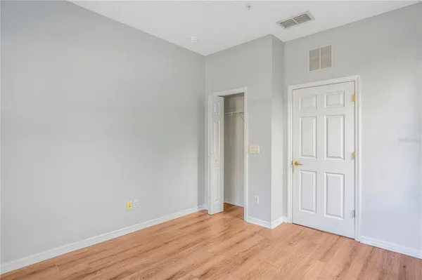 an empty room with windows and entrance