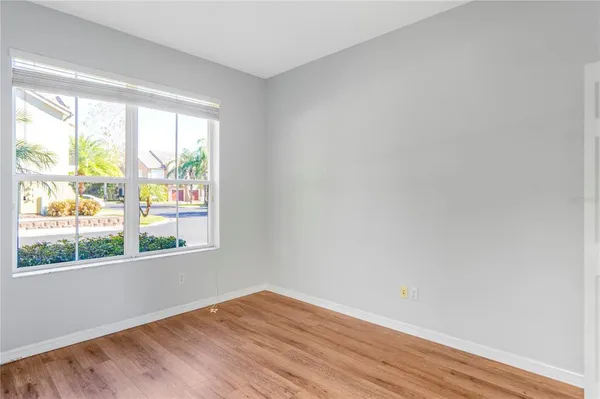 a white toilet sitting next to a white walls