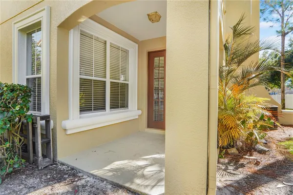 an aerial view of a house with yard and swimming pool