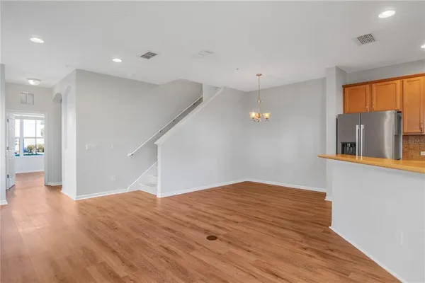 a living room with fireplace furniture and a large window