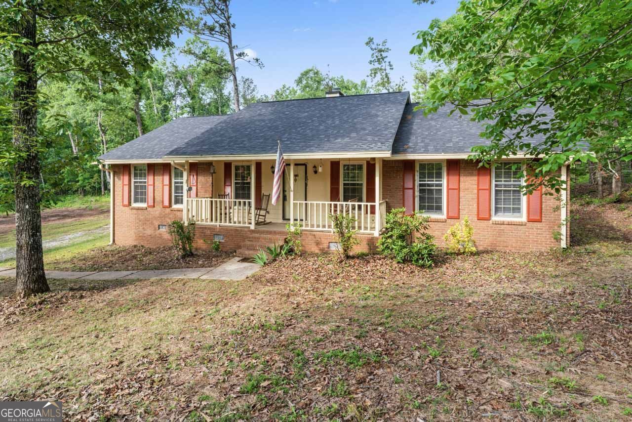 368 Henry Higgins Road Jackson, GA 30233 - Photo 1 of 1 a view of a yard in front of a house with large tree
