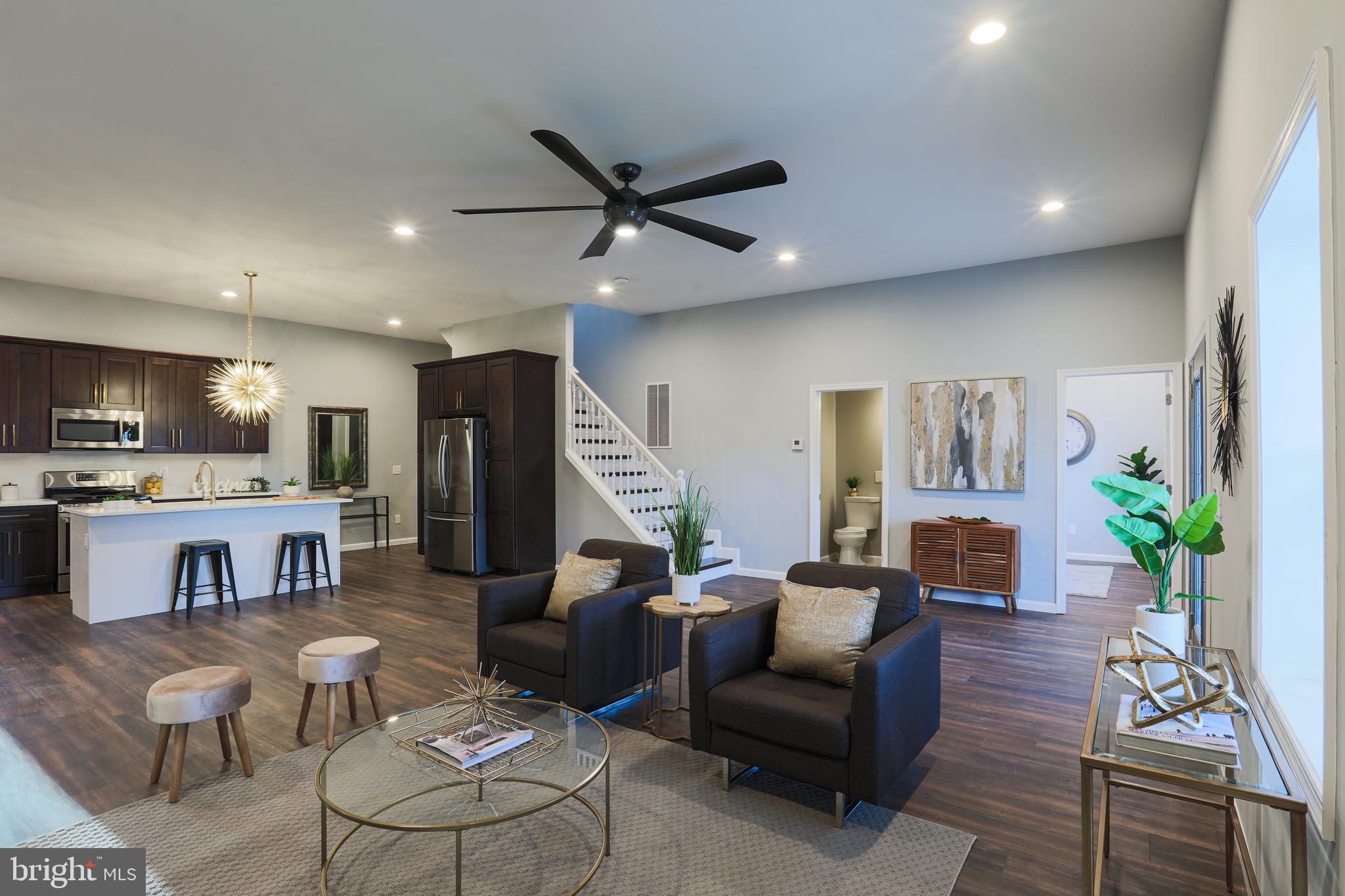 Spacious living room with Alexa ceiling fan!