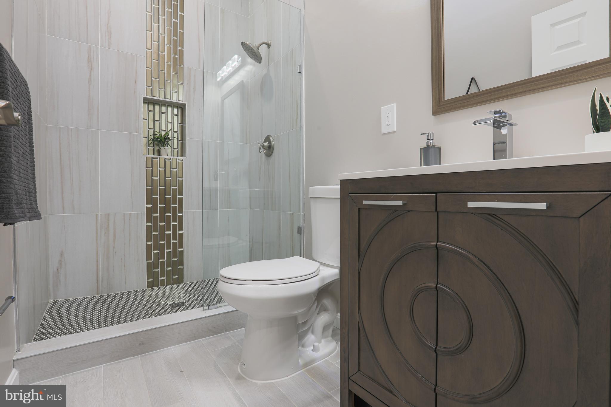 1210 Keithmont Road Baltimore, MD 21228 - Photo 12 of 41 Modern and stylish bathroom tiles and vanity!