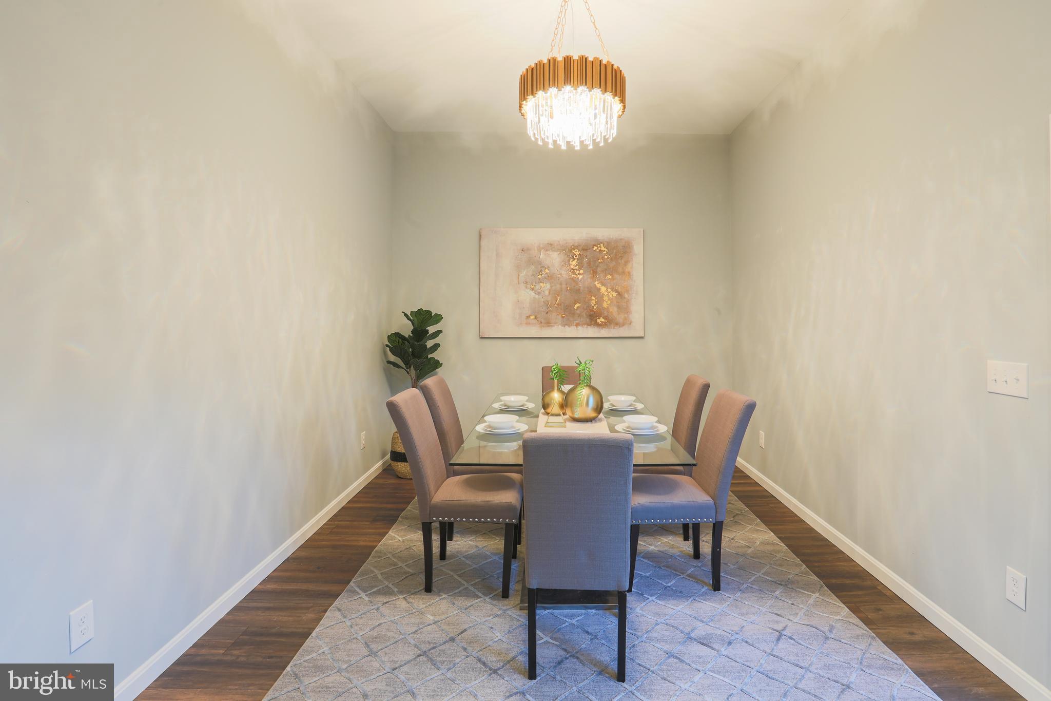 1210 Keithmont Road Baltimore, MD 21228 - Photo 9 of 41 Formal dining room with showstopper chandelier!