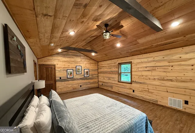 a view of hallway with wooden floor