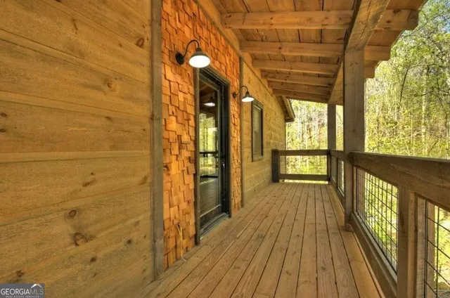 a view of a wooden house with a yard