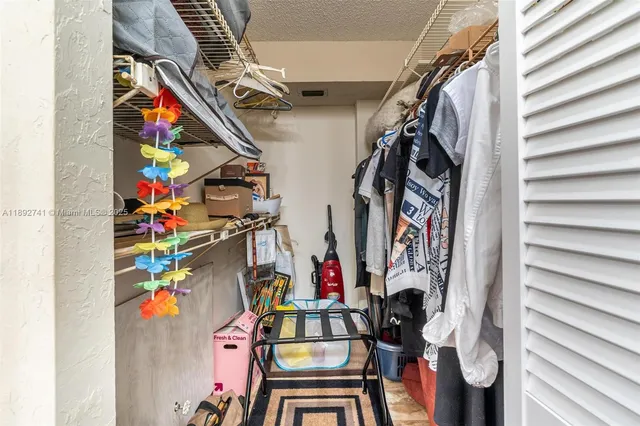 a bathroom with a sink a mirror and a shower