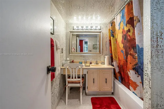 a bedroom with a bed and a dresser in it