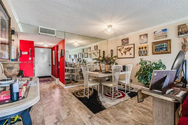 a view of a livingroom with furniture and a flat screen tv