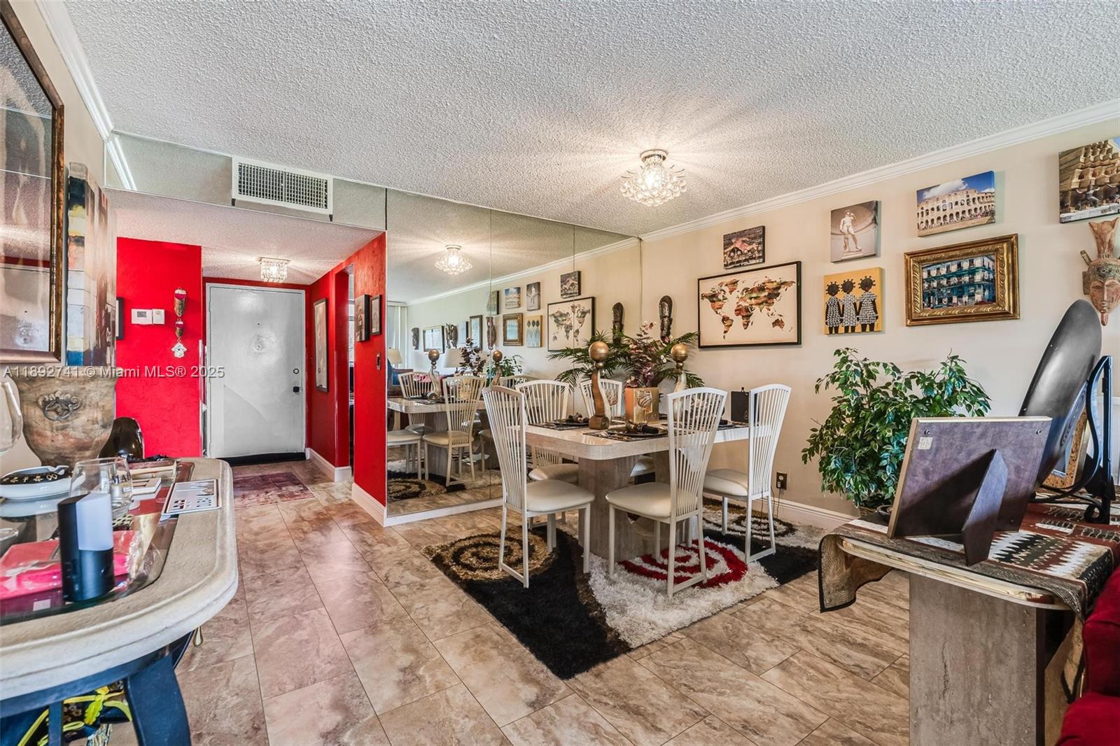 3671 Environ Boulevard, Unit 169 Lauderhill, FL 33319 - Photo 2 of 23 a view of a livingroom with furniture and a flat screen tv
