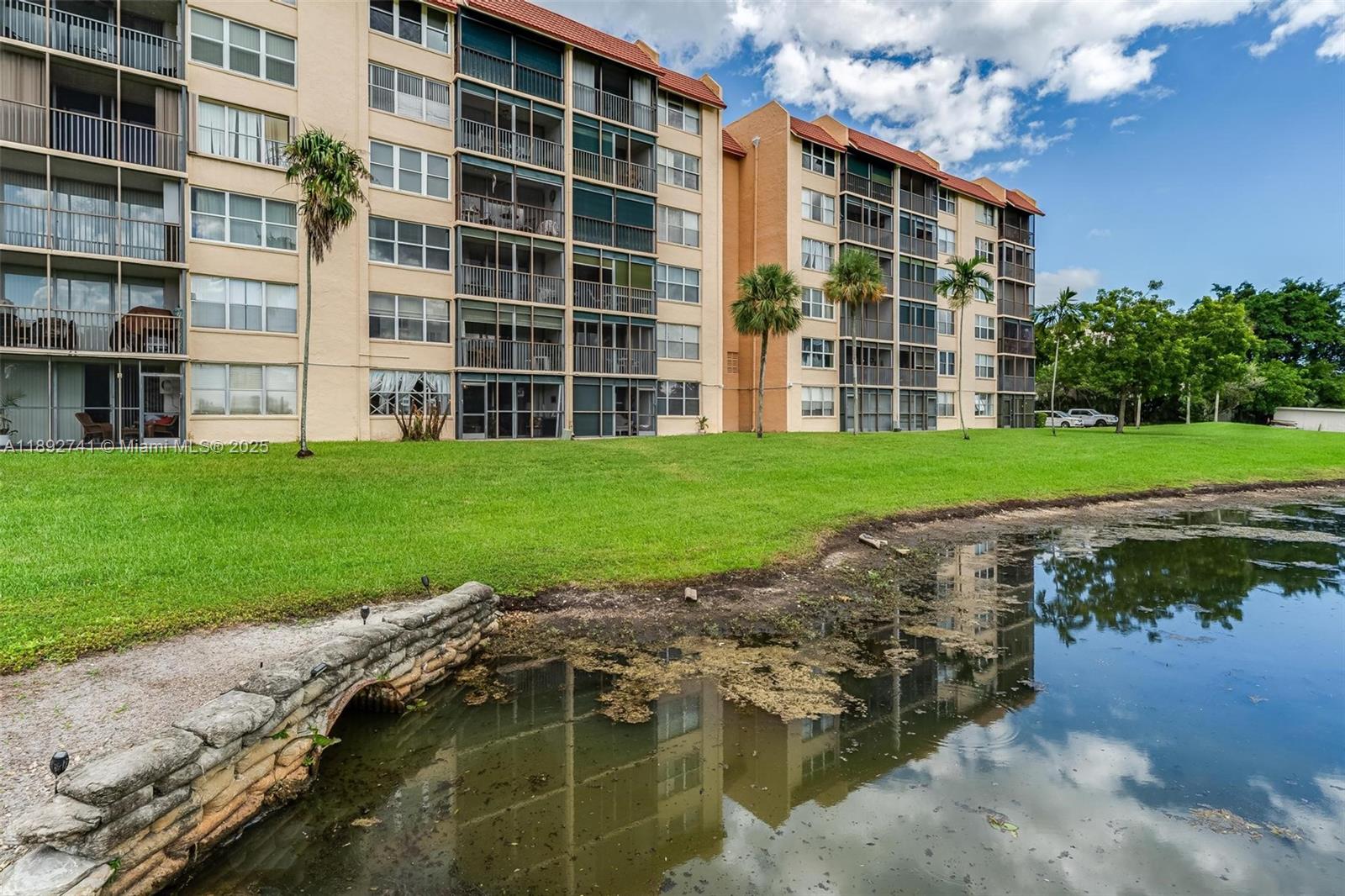 3671 Environ Boulevard, Unit 169 Lauderhill, FL 33319 - Photo 21 of 23 a view of a building with a yard