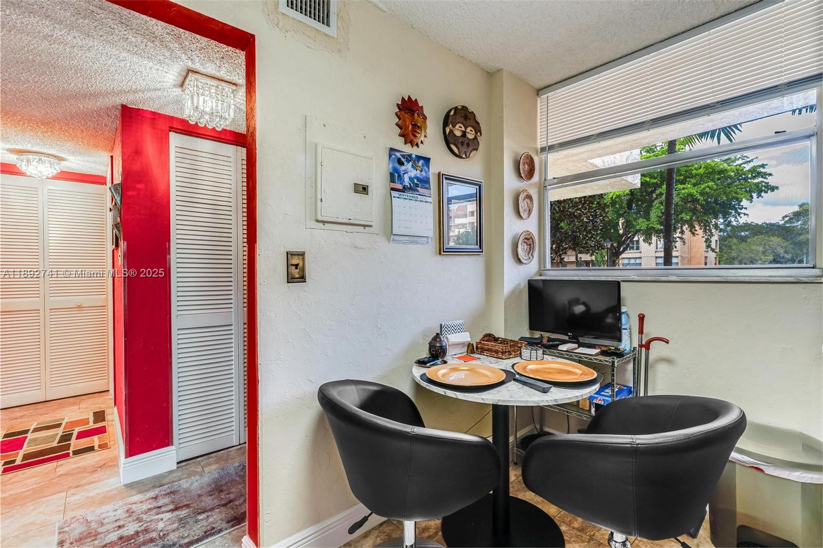 3671 Environ Boulevard, Unit 169 Lauderhill, FL 33319 - Photo 5 of 23 a living room with furniture and a potted plant