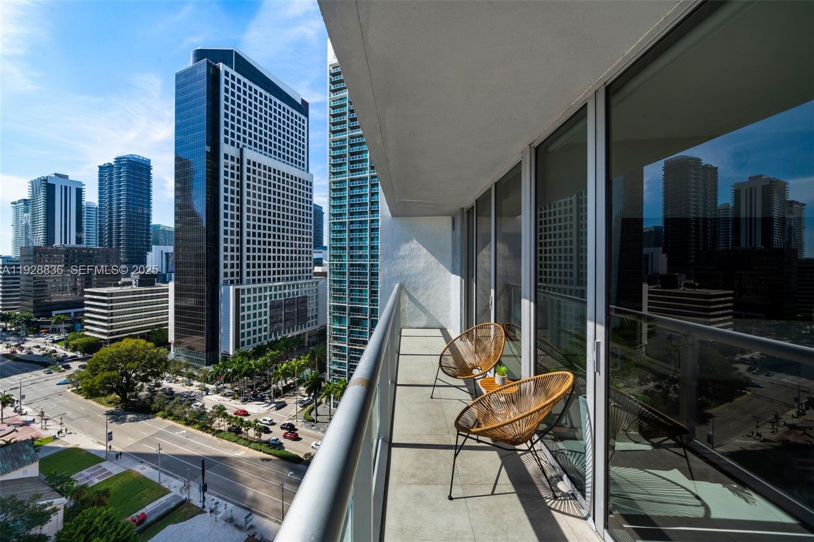 485 Brickell Avenue, Unit 1709 Miami, FL 33131 - Photo 21 of 22 a view of balcony with two chairs and a potted plant