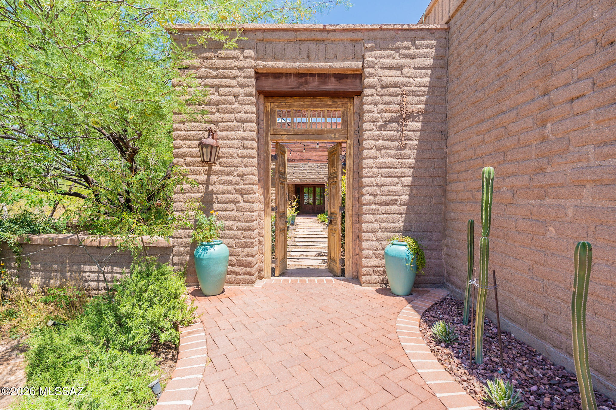 11725 East Spanish Ridge Place Tucson, AZ 85730 - Photo 12 of 51 a front view of a house with a porch