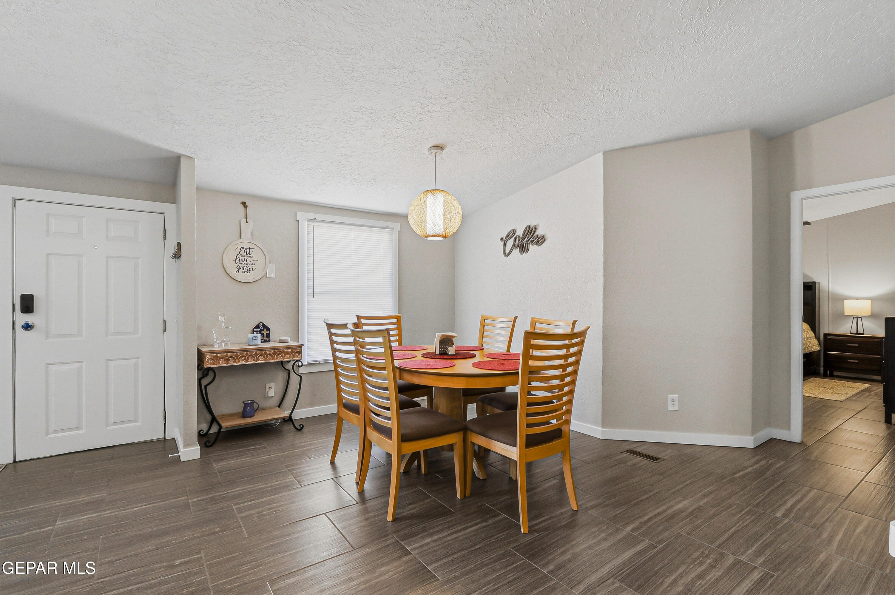 2901 Cook Street Truth or Consequences, NM 87901 - Photo 10 of 31 a view of a dining room with furniture and wooden floor