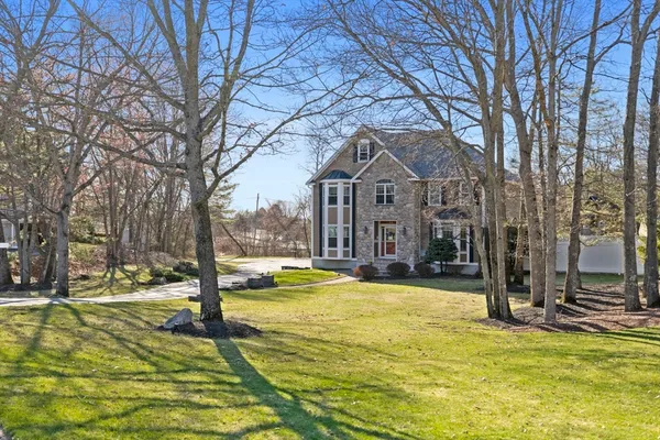 a view of a building with snow on the trees