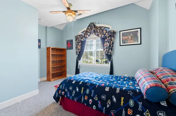 a bathroom with a granite countertop sink a mirror and vanity
