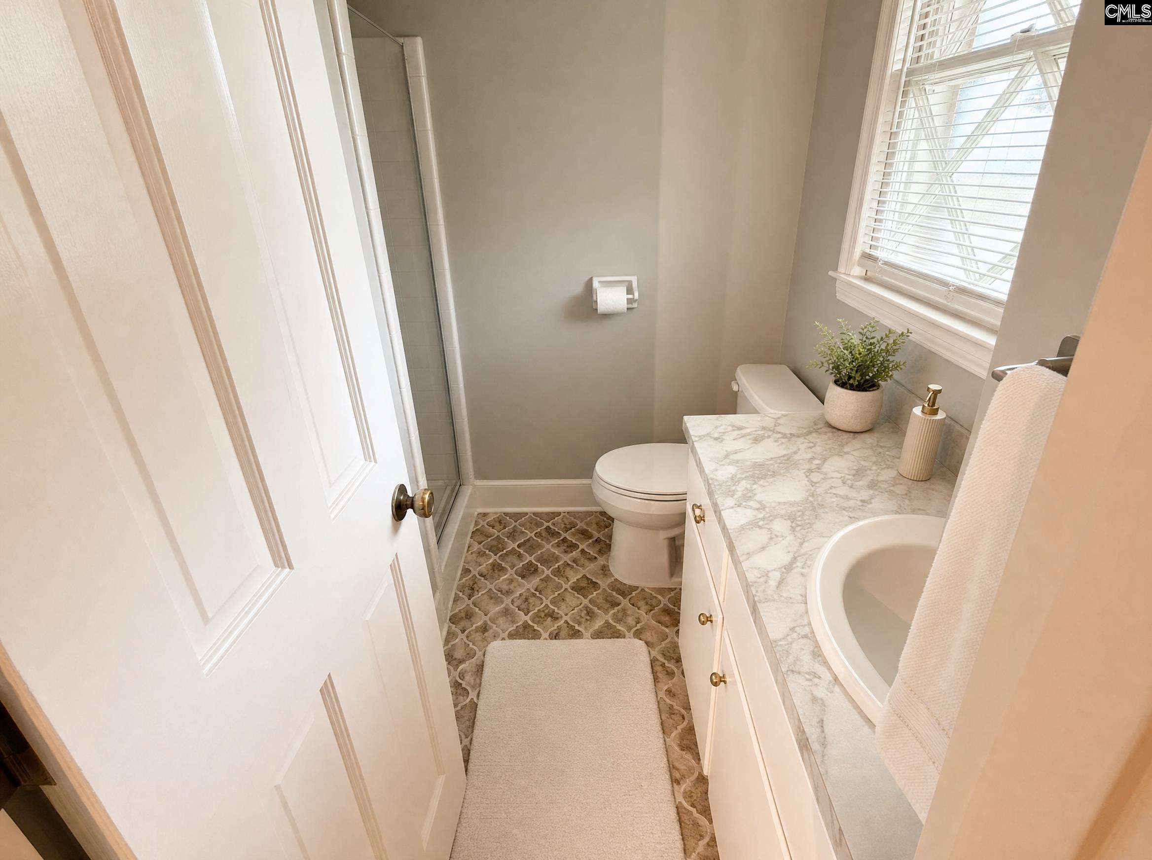 333 Lewisham Road Columbia, SC 29210 - Photo 18 of 35 a bathroom with a sink and toilet