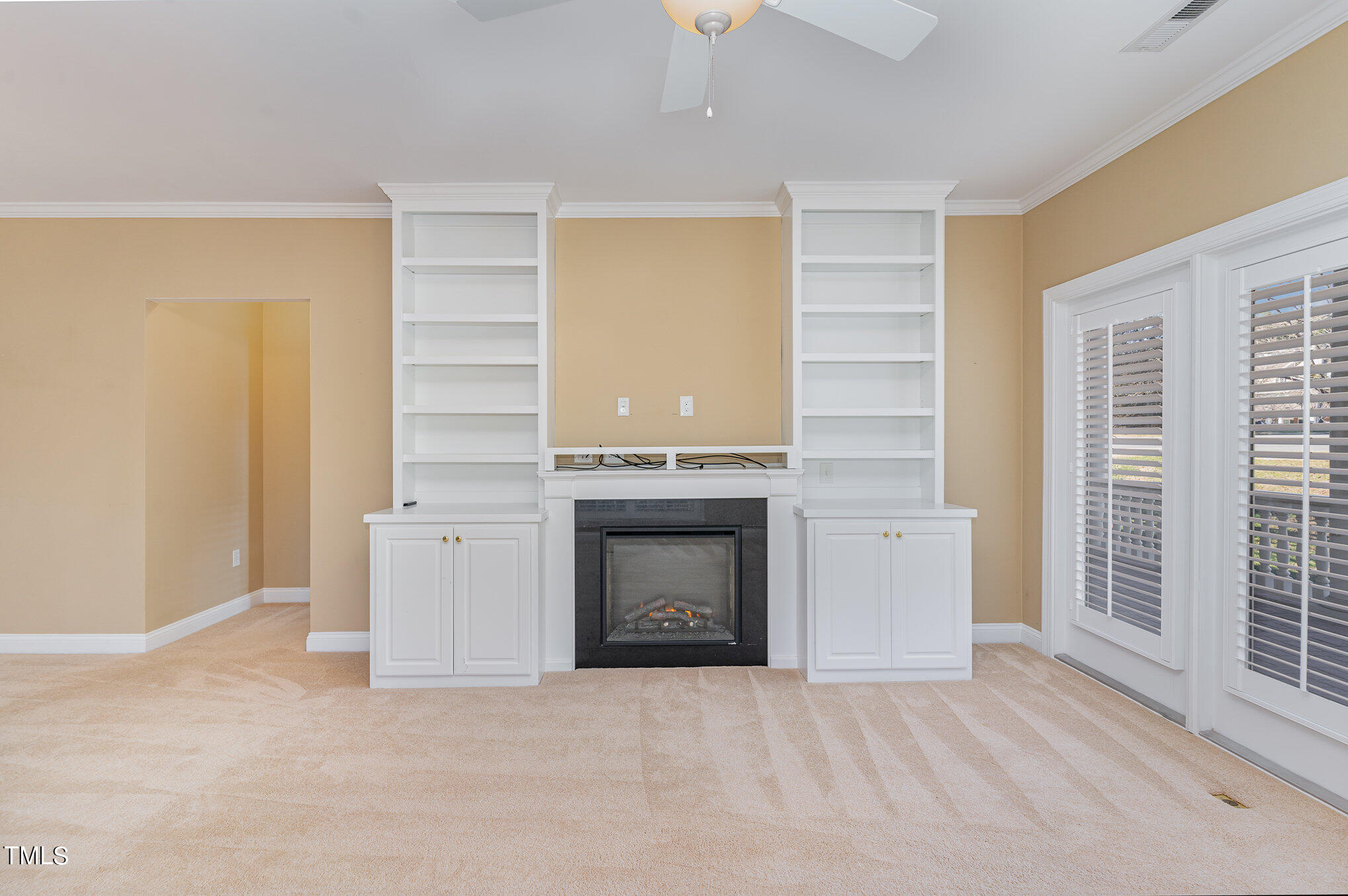 7510 Lead Mine Road, Unit 104 Raleigh, NC 27615 - Photo 5 of 23 Living room with beautiful built-in cabinets, shelving and fireplace insert. Added around 2018.