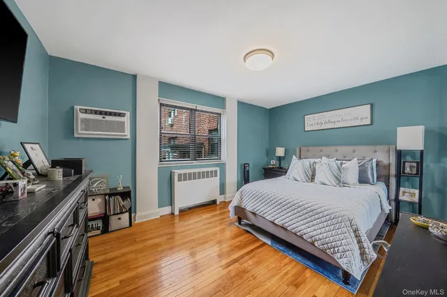 a bedroom with a bed and a desk